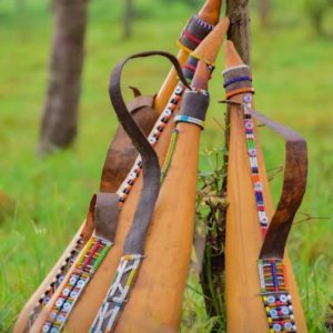 Handcrafted Maasai beaded calabash by Nalaakiti featuring vibrant colourful traditional African seed bead patterns covering a natural gourd, made in Kenya for Moransbead as a cultural décor piece