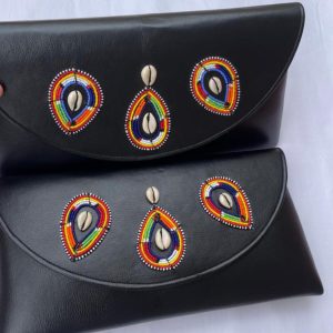 Handcrafted Maasai beaded leather medium clutch purse by Naiswaku featuring vibrant colourful traditional African seed bead patterns on genuine leather, made in Kenya for Moransbead