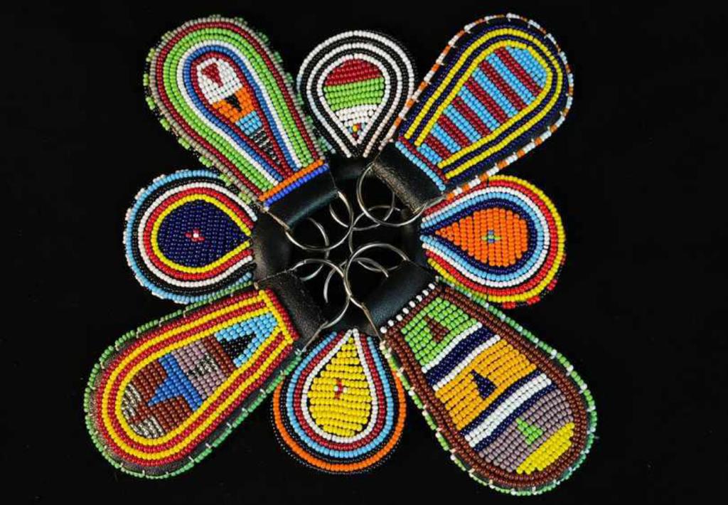 Handcrafted Maasai beaded keyholder bundle set by Naiswaku featuring vibrant colourful traditional African seed bead patterns on leather and metal key rings, made in Kenya for Moransbead