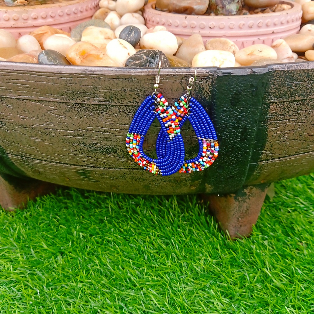 Handcrafted Maasai beaded drop dangle earrings by Naiswaku featuring vibrant colourful traditional African seed bead patterns, lightweight and elegant, made in Kenya for Moransbead