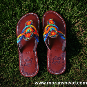 Handcrafted Maasai beaded leather sandals for women by Kisieku featuring vibrant colourful traditional African seed bead patterns on genuine leather straps and sole, made in Kenya for Moransbead
