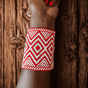 Handcrafted Maasai beaded wide cuff bracelet by Sianto featuring vibrant colourful traditional African seed bead patterns, made in Kenya for Moransbead