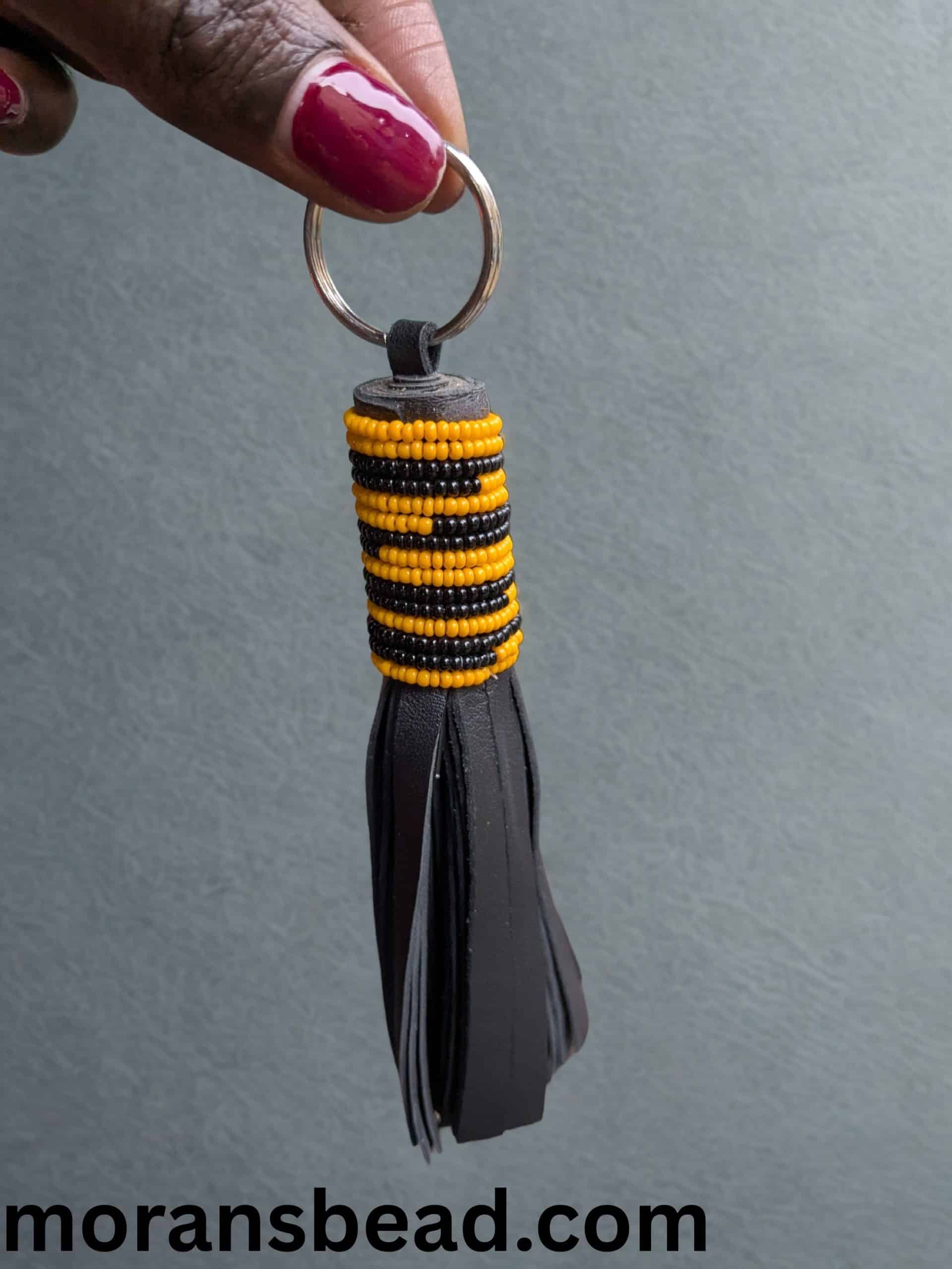Handmade Maasai beaded leather keychain – ethical African accessory made by Maasai women in Kenya.