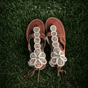 Handcrafted Maasai beaded leather sandals for women by Kisieku featuring vibrant colourful traditional African seed bead patterns on genuine leather straps and sole, made in Kenya for Moransbead