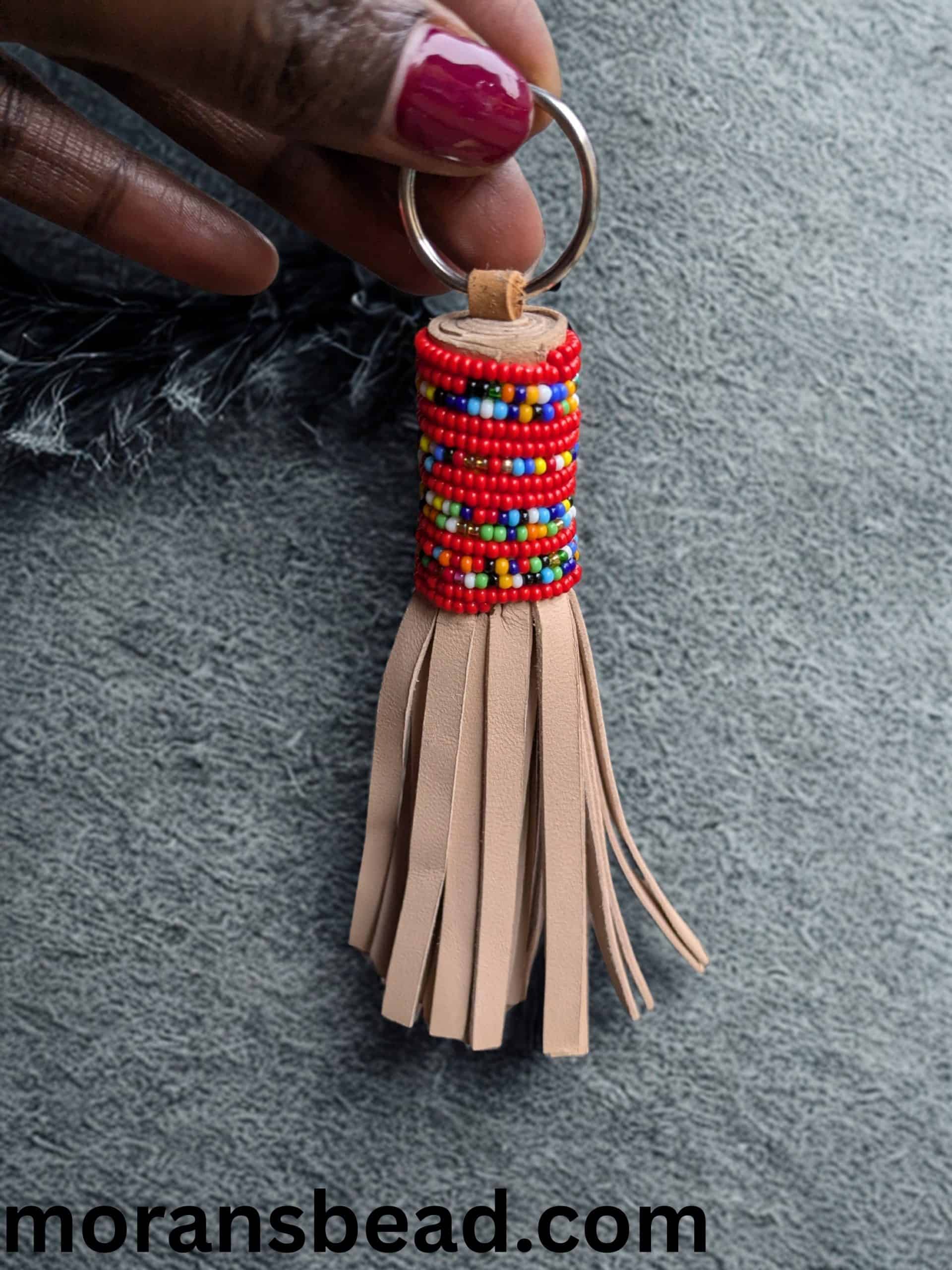 Keychain with colorful Maasai beads and leather tassel, handcrafted African accessory.