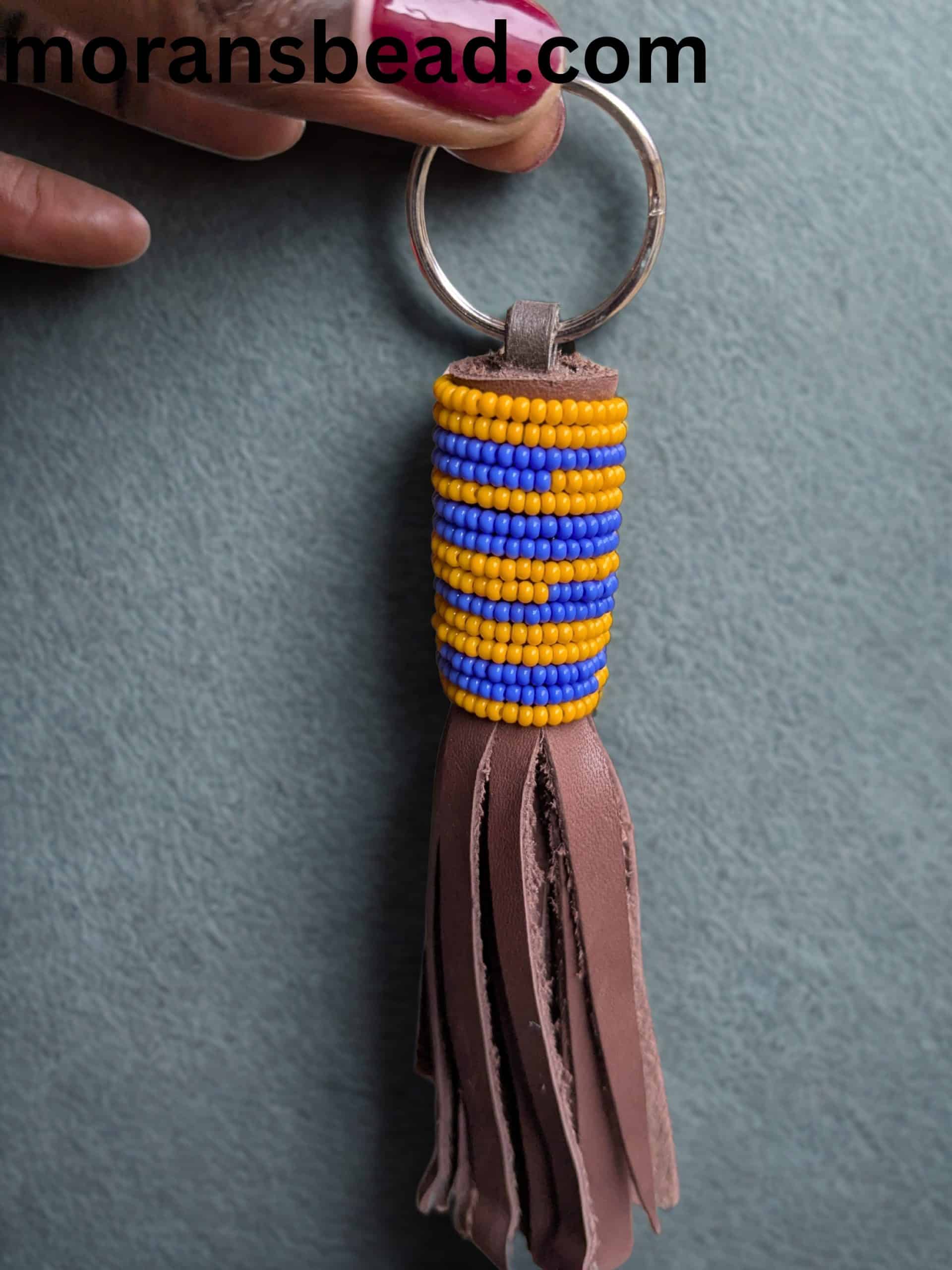 Beaded leather keychain with colorful Maasai beads and leather tassel, handcrafted in Africa.